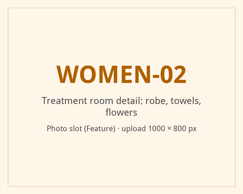 [ALT: Treatment room detail: robe, towels, flowers, Vitali Wellness & Spa]